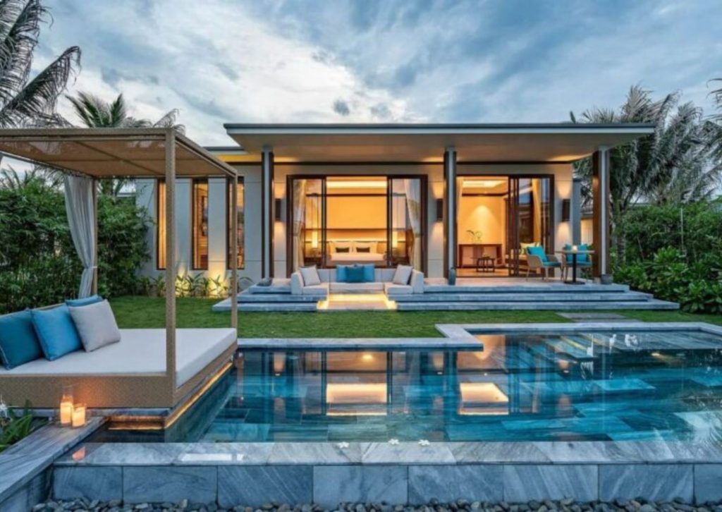 Modern eco-friendly luxury villa with a private turquoise pool